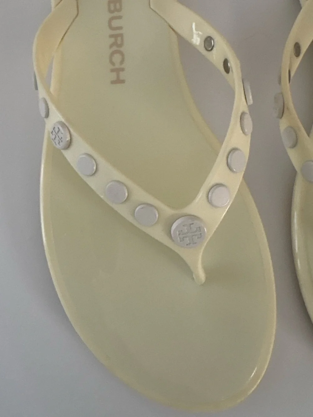 Tory Burch Ivory/pale yellow thong jelly  sandals size 7. Studded w/metal logos
